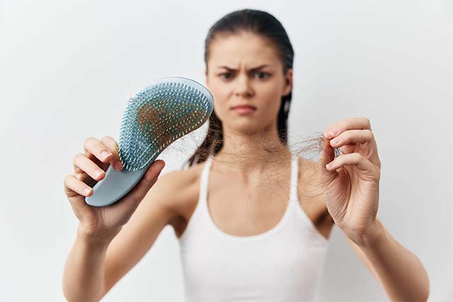 caída de pelo en una mujer